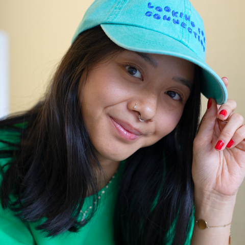 'looking for connection' green hat