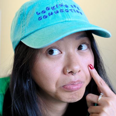 'looking for connection' green hat