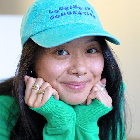 'looking for connection' green hat