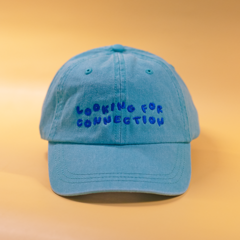 'looking for connection' green hat